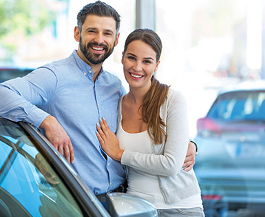 Happy couple using Union Plus Auto Buying Service