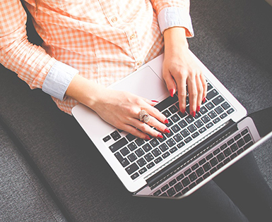 Young woman searching on the web for consumer reviews