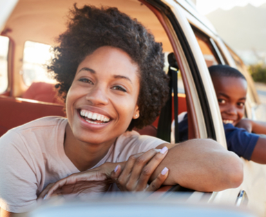 Happy woman using Union Plus Auto Insurance